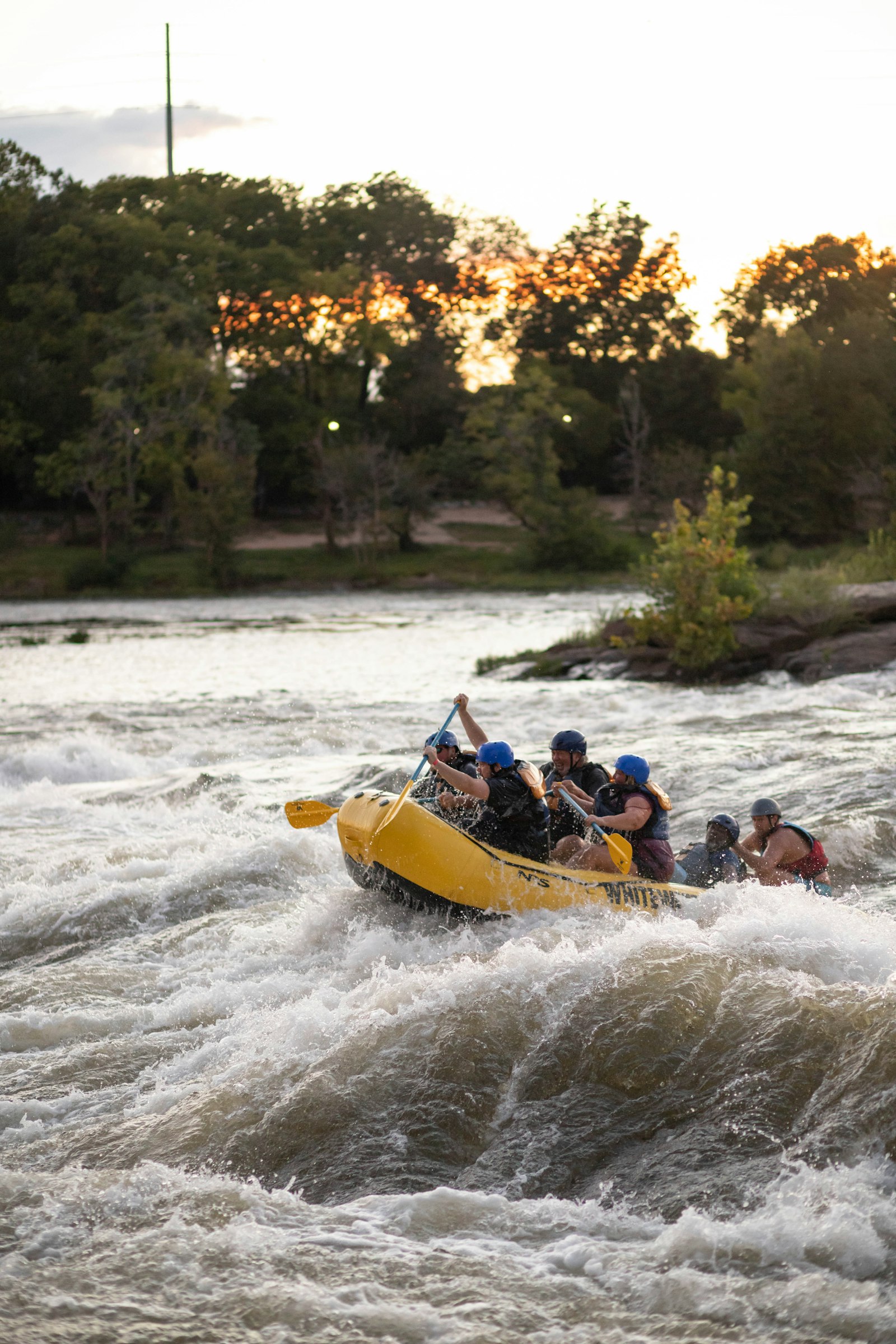 White water rafting adventure in fast river rapids